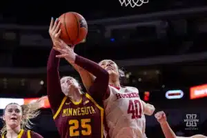 Nebraska Cornhusker center Alexis Markowski (40) reaches for the rebound against Minnesota Golden Gopher guard Grace Grocholski (25) in the second half during a college basketball game Saturday, February 24, 2024, in Lincoln, Neb. Photo by John S. Peterson.