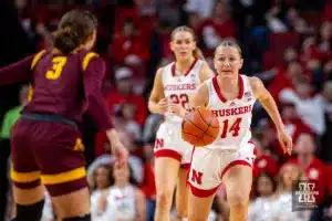 Nebraska Cornhusker guard Callin Hake (14) dribbles the ball down the court against Minnesota Golden Gopher guard Amaya Battle (3) in the first half during a college basketball game Saturday, February 24, 2024, in Lincoln, Neb. Photo by John S. Peterson.