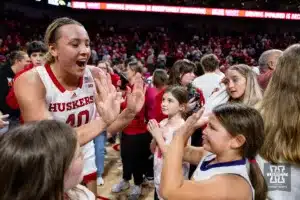 Nebraska Cornhusker center Alexis Markowski (40) giving high fives after the win over the Iowa Hawkeyes during a college basketball game on Sunday, February 11, 2024, in Lincoln, Nebraska. Photo by John S. Peterson.