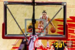 Nebraska Cornhusker guard Callin Hake (14) dribbles the ball against Iowa Hawkeye guard Caitlin Clark (22) in the fourth quarter during a college basketball game on Sunday, February 11, 2024, in Lincoln, Nebraska. Photo by John S. Peterson.