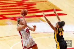 Nebraska Cornhusker center Alexis Markowski (40) takes a shot against Iowa Hawkeye forward Hannah Stuelke (45) in the third quarter during a college basketball game on Sunday, February 11, 2024, in Lincoln, Nebraska. Photo by John S. Peterson.