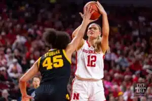 Nebraska Cornhusker forward Jessica Petrie (12) makes a jumpshot against Iowa Hawkeye forward Hannah Stuelke (45) in the second quarter during a college basketball game on Sunday, February 11, 2024, in Lincoln, Nebraska. Photo by John S. Peterson.