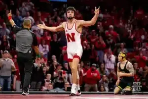 149: Nebraska Cornhusker No. 1 Ridge Lovett (19-0) celebrates a win over Michigan Wolverine No. 6 Austin Gomez (5-0) during a college wrestling match on Friday, February 9, 2024, in Lincoln, Nebraska. Photo by John S. Peterson.