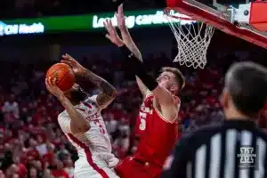 Nebraska Cornhusker guard Brice Williams (3) goes for a lay up against Wisconsin Badger forward Tyler Wahl (5) in the second half during a college basketball game on Thursday, February 1, 2024, in Lincoln, Nebraska. Photo by John S. Peterson.