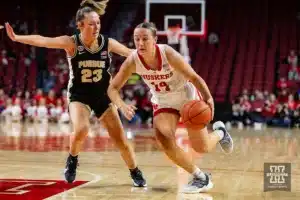 Nebraska Cornhusker guard Callin Hake (14) drives to the lane against Purdue Boilermaker guard Abbey Ellis (23) in the first half during a college basketball game on Wednesday, January 31, 2024, in Lincoln, Nebraska. Photo by John S. Peterson.