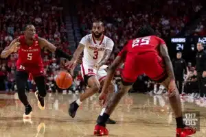 Nebraska Cornhusker guard Brice Williams (3) makes a pass against Rutgers Scarlet Knight guard Jeremiah Williams (25) and Aundre Hyatt in the first half during a college basketball game Sunday, March 3, 2024, in Lincoln, Neb. Photo by John S. Peterson.