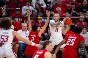 Nebraska Cornhusker guard C.J. Wilcher (0) looks to pass against Rutgers Scarlet Knight guard Noah Fernandes (2) the first half during a college basketball game Sunday, March 3, 2024, in Lincoln, Neb. Photo by John S. Peterson.