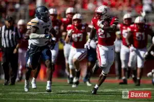 Nebraska Cornhusker running back Emmett Johnson (21) runs with the ball against the UTEP Miners during the college football game Saturday, August 31, 2024, in Lincoln, Nebraska. Photo John S. Peterson.