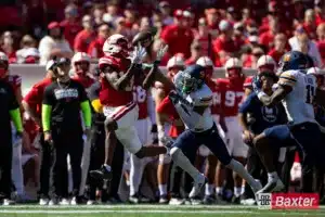 Nebraska Cornhusker wide receiver Isaiah Neyor (18) makes a catch against UTEP Miner cornerback Jaylon Shelton (9) during the college football game Saturday, August 31, 2024, in Lincoln, Nebraska. Photo John S. Peterson.