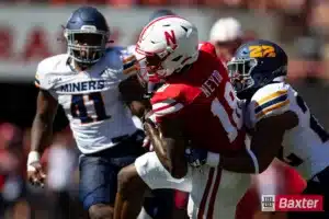 Nebraska Cornhusker wide receiver Isaiah Neyor (18) runs with the ball against UTEP Miner linebacker Josiah Allen (22) during the college football game Saturday, August 31, 2024, in Lincoln, Nebraska. Photo John S. Peterson.