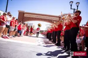 Members of the Cornhusker Marching Band entertaining the fans waiting for the Huskers to arrive before taking on UTEP during the college football game Saturday, August 31, 2024, in Lincoln, Nebraska. Photo John S. Peterson.
