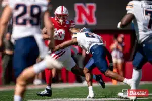 Nebraska Cornhuskers wide receiver Isaiah Garcia-Castaneda (13) tries to elude a tackler during a game against the UTEP Miners Saturday, August 31 in Memorial Stadium in Lincoln, Nebraska. Photo by Eric Francis