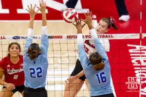 Nebraska Cornhusker Lindsay Krause (22) spikes the ball past Texas A&M CC Islanders Alex Hoglund (16) and Katelyn Krienke (22) during the college volleyball game Friday, August 30, 2024, in Lincoln, Nebraska. Photo John S. Peterson.