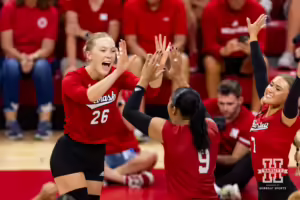 Nebraska Cornhusker Lauren Stivrins gives high fives to Kenndi Orr during the Red/White Volleyball Game Saturday, August 24, 2024, in Lincoln, Nebraska. Photo John S. Peterson.
