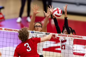 Nebraska Cornhuskers Rebekah Allick (5) and Harper Murray (27) blocks the ball against guest player Conner Schreier during the Red/White Volleyball Game Saturday, August 24, 2024, in Lincoln, Nebraska. Photo John S. Peterson.