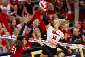 Nebraska Cornhusker Andi Jackson (15) spikes the ball against Skyler Pierce (21) during the Red/White Volleyball Game Saturday, August 24, 2024, in Lincoln, Nebraska. Photo John S. Peterson.