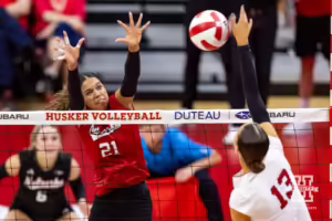 Nebraska Cornhusker Skylar Pierce (21) defends against Merritt Beason (13) during the Red/White Volleyball Game Saturday, August 24, 2024, in Lincoln, Nebraska. Photo John S. Peterson.