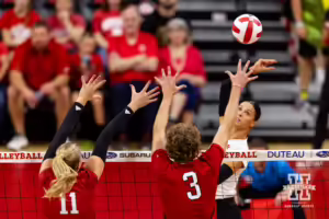 Nebraska Cornhusker Merritt Beason (13) bumps the ball over the net during the Red/White Volleyball Game Saturday, August 24, 2024, in Lincoln, Nebraska. Photo John S. Peterson.