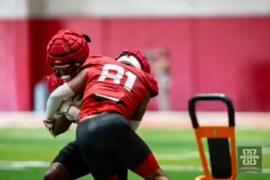 Nebraska Cornhuskers Ismael Smith Flores (81) and MJ Sherman (48) running a drill during football practice Friday, August 16, 2024, in Lincoln, Nebraska. Photo John S. Peterson.