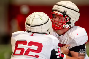 Nebraska Cornhuskers Sam Sledge (62) and Ben Scott (66) battle it out during football practice Friday, August 16, 2024, in Lincoln, Nebraska. Photo John S. Peterson.