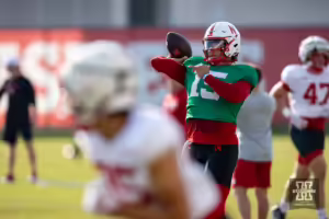 Nebraska Cornhusker Dylan Raiola (15)throws a pass during football practice Friday, August 16, 2024, in Lincoln, Nebraska. Photo John S. Peterson.