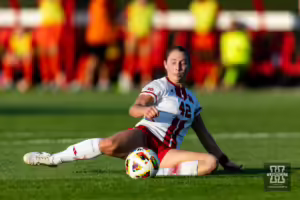 Nebraska Cornhusker forward Sarah Weber (42) kicks the ball against the Oklahoma St. Cowgirls in the first half during a college women's soccer match Friday, August 16, 2024, in Lincoln, Nebraska. Photo John S. Peterson.