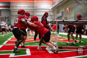 Nebraska Cornhusker Nash Hutmacher (0) busting out to take on during football practice Friday, August 9, 2024, in Lincoln, Nebraska. Photo John S. Peterson.