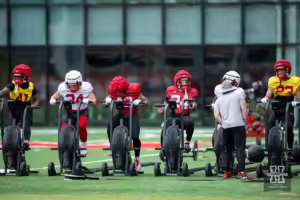 Nebraska Cornhusker players warming down on the bikes during football practice Friday, August 9, 2024, in Lincoln, Nebraska. Photo John S. Peterson.