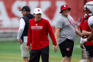 Nebraska Cornhusker coach Glenn Thomas working with the quarterback during football practice Friday, August 9, 2024, in Lincoln, Nebraska. Photo John S. Peterson.