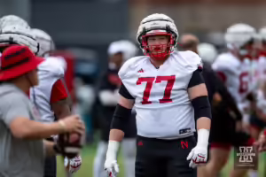 Nebraska Cornhusker Gunnar Gottula (77) running blocking drills during football practice Friday, August 9, 2024, in Lincoln, Nebraska. Photo John S. Peterson.