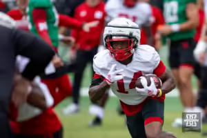 Nebraska Cornhusker Rahmir Johnson (14) runs with the ball during football practice Friday, August 9, 2024, in Lincoln, Nebraska. Photo John S. Peterson.