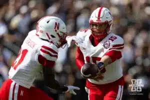 Nebraska Cornhusker quarterback Dylan Raiola (15) hands the ball off to running back Emmett Johnson (21) against the Purdue Boilermakers during a college football game Saturday, September 28, 2024, in West Lafayette, Indiana. Photo by John S. Peterson.