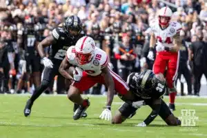 Nebraska Cornhusker wide receiver Isaiah Neyor (18) tackled by Purdue Boilermaker defensive back Joseph Jefferson II (32) during a college football game Saturday, September 28, 2024, in West Lafayette, Indiana. Photo by John S. Peterson.