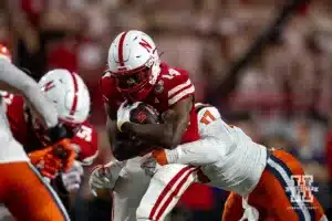 Nebraska Cornhusker running back Rahmir Johnson (14) runs with the ball against Illinois Fighting Illini linebacker Gabe Jacas (17) during a college football game Firiday, September 20, 2024, in Lincoln, Nebraska. Photo by John S. Peterson.