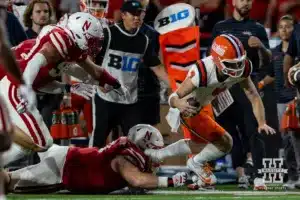 Nebraska Cornhusker defensive lineman Nash Hutmacher (0) trips up Illinois Fighting Illini quarterback Luke Altmyer (9) during a college football game Firiday, September 20, 2024, in Lincoln, Nebraska. Photo by John S. Peterson.