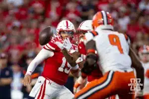 Nebraska Cornhusker quarterback Dylan Raiola (15) hands off the ball to Jacory Barney Jr.as grabs in middle air against Illinois Fighting Illini linebacker Seth Coleman (9) during a college football game Firiday, September 20, 2024, in Lincoln, Nebraska. Photo by John S. Peterson.