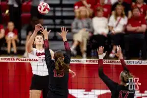 Nebraska Cornhusker Lindsay Krause (22) tips the ball against Stanford Cardinal Elia Rubin (13) in the third set during a college volleyball match Wednesday, September 18, 2024, in Lincoln, Nebraska. Photo by John S. Peterson.