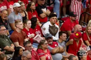 Nebraska Cornhusker quarterback Dylan Raiola watching the action against the Stanford Cardinal during a college volleyball match Wednesday, September 18, 2024, in Lincoln, Nebraska. Photo by John S. Peterson.