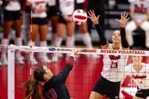 Nebraska Cornhusker Merritt Beason (13) jumps to block Stanford Cardinal Elia Rubin (13) in the second set during a college volleyball match Wednesday, September 18, 2024, in Lincoln, Nebraska. Photo by John S. Peterson.