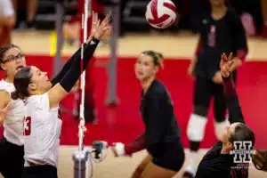 Nebraska Cornhusker Merritt Beason (13) reaches to block Stanford Cardinal Elia Rubin (13) in the second set during a college volleyball match Wednesday, September 18, 2024, in Lincoln, Nebraska. Photo by John S. Peterson.