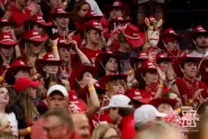 Nebraska Cornhusker student body wearing red Husker cowboy hats during a college volleyball match against the Stanford Cardinal Wednesday, September 18, 2024, in Lincoln, Nebraska. Photo by John S. Peterson.