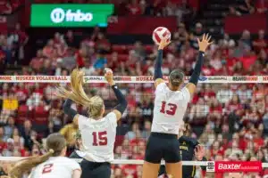Nebraska Cornhusker Merritt Beason (13) jumps up to block a spike from Wichita State during the college volleyball match Saturday, September 15, 2024, in Lincoln, Nebraska. Photo Jaelle Johnson.
