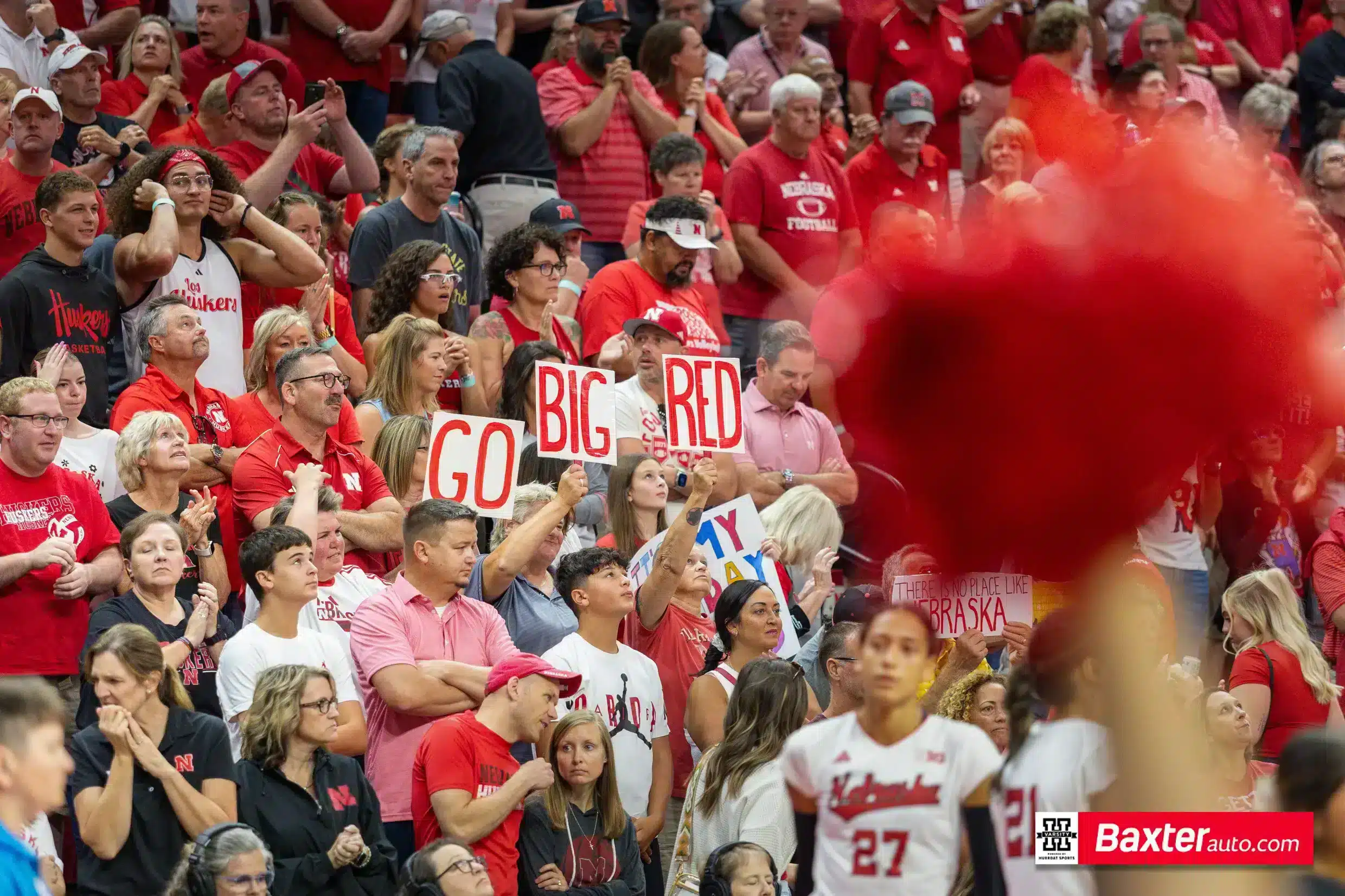 Nebraska Cornhusker fans holding up a Go Big Red signs against Wichita State during the college volleyball match Saturday, September 15, 2024, in Lincoln, Nebraska. Photo Jaelle Johnson.