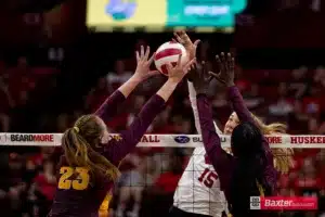 Nebraska Cornhusker Andi Jackson (15) spikes the ball against Arizona State Sundevil middle blocker Claire Jeter (23) and Shania Cromartie in the second set during the college volleyball match Friday, September 13, 2024, in Lincoln, Nebraska. Photo John S. Peterson.
