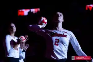 Nebraska Cornhusker Bergen Reilly (2) throws a mini volleyball to the fans when introduced during the college volleyball match against the Arizona State Sundevils Friday, September 13, 2024, in Lincoln, Nebraska. Photo John S. Peterson.