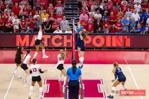 Nebraska Cornhusker outside hitter Harper Murray (27) spikes the ball for match point against the Creighton Bluejays in the fifth set during the college volleyball match Tuesday, September 10, 2024, in Lincoln, Nebraska. Photo John S. Peterson.