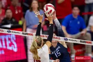 Nebraska Cornhusker middle blocker Andi Jackson (15) and Creighton Bluejay setter Kendra Wait (15) battle at the net in the third set during the college volleyball match Tuesday, September 10, 2024, in Lincoln, Nebraska. Photo John S. Peterson.
