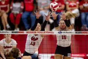 Nebraska Cornhusker middle blocker Andi Jackson (15) tries to block a spike from Creighton Bluejay outside hitter Norah Sis (2) during the college volleyball match Tuesday, September 10, 2024, in Lincoln, Nebraska. Photo John S. Peterson.