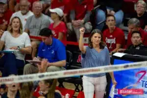 Creighton Bluejay head coach Kirsten Bernthal Booth give a fist pump after a big score against the Nebraska Cornhuskers in the fourth set during the college volleyball match Tuesday, September 10, 2024, in Lincoln, Nebraska. Photo John S. Peterson.