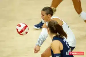 Creighton Bluejay Maddy Bilinovic (22) digs the ball against the Nebraska Cornhuskers in the fourth set during the college volleyball match Tuesday, September 10, 2024, in Lincoln, Nebraska. Photo John S. Peterson.